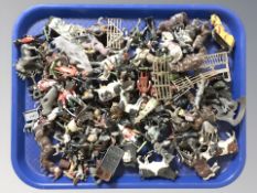 A collection of painted die cast miniatures including farm animals, soldiers, etc.