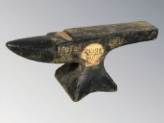 A small cast iron anvil, length 23 cm.