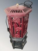 A Esse painted cast iron electric heater in the form of a stove,
