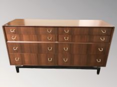 A 20th century G Plan teak eight drawer chest, designed by E Gomme, 150 cm W x 48 cm D x 83 cm H.