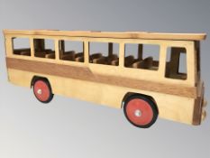 A handmade wooden miniature model of a bus, length 60 cm.