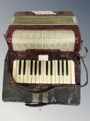 A vintage Italian piano accordion in carry case.