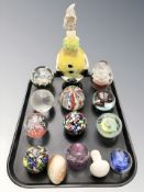 A Murano glass clown decanter and a group of paperweights.