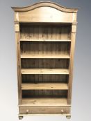A contemporary pine open bookcase, 110 cm W x 45 cm D x 212 cm H.