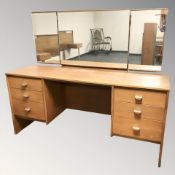 A 20th century Stag teak mirror back dressing table,