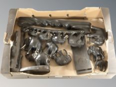 A group of African carved ebony elephants.