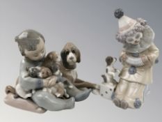 A Lladro figure of a boy clown with a squeeze box,