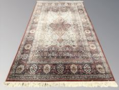 A machine-made carpet of Persian design,