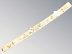 A vintage webbing army belt with various badges.