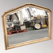 A reproduction gilt and bevelled over mantel mirror, 118 cm W x 93 cm H.