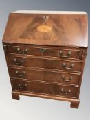 A reproduction mahogany fall front writing bureau, 75 cm W x 48 cm D x 97 cm H.