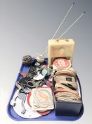 A large quantity of coasters with various advertising, a vintage Smiths Timecal clock, wall plaques,