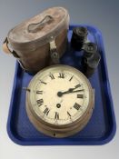 A pair of Bausch & Lomb 6x30 binoculars in leather case, and a brass cased ships circular timepiece.