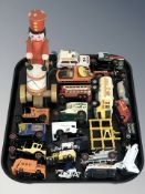 A group of die cast delivery vans including Matchbox, further vehicles, wooden model of a drummer,