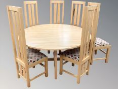 A good quality circular beech dining room table, diameter 150 cm,