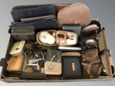 A group of vintage razors, shaving sets, brushes, tins, etc.