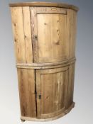 A 19th century pine bow front corner cabinet, height 175 cm.