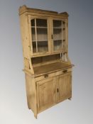 An early 20th century pine dresser, 107 cm W x 50 cm D x 210 cm H.