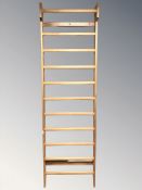 A Scandinavian pine ladder wall rack, width 71 cm.