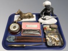 A Hohner accordion, bundle of chopsticks, brass letter opener in the form of a dachshund,