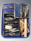 A group of precision drawing instrument sets, rules, etc.