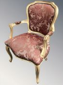 A reproduction French style gilt open salon armchair, width 64 cm.
