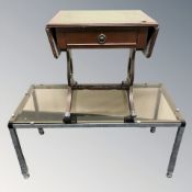 A modern smoked glass topped rectangular table and a further reproduction drop leaf table.