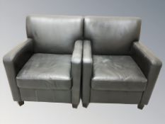 A pair of late 20th century black leather armchairs, width 71 cm.