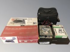A boxed Ion USB turntable and a further box containing Fujifilm and other cameras, video camera,