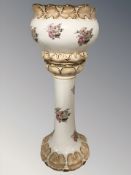 A transfer printed pottery jardiniere on stand,