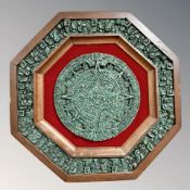 A Far Eastern octagonal relief panel, width 34.5 cm.