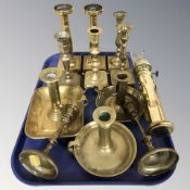 A group of brass candlesticks, chamber sticks, wall sconce, etc.