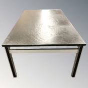 A Scandinavian black slate topped rectangular coffee table on metal support,