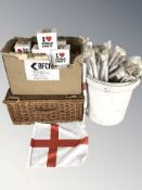 A quantity of England flag car pennants, further boxed mugs, wicker hamper.