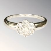 A 9ct white gold diamond cluster ring, size P½ CONDITION REPORT: 2.