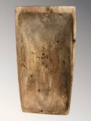 A large 19th century rustic pine dough board, length 78 cm.