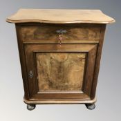 A 19th century continental walnut serpentine fronted side cabinet,