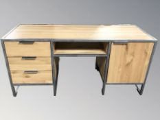 A modern oak and burnished metal twin pedestal desk, 170 cm W x 60 cm D x 80 cm H.