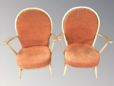A pair of Ercol elm spindle backed armchairs,