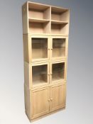 A pair of Scandinavian glazed double door cupboards, width 96 cm,