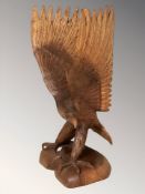 A wooden sculpture of an eagle, height 51 cm.