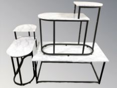 A group of faux marble topped tables