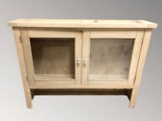 A contemporary glazed double door dresser top,