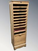 An early 20th century oak tambour front pedestal filing cabinet, 50 cm W x 40 cm D x 156 cm H.