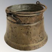A copper swing handled cooking pot, height 26 cm excluding handle.