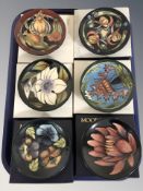 Six modern Moorcroft pin dishes, with boxes, each 12 cm diameter.