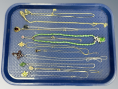 A group of sterling silver and silver mounted necklaces with pendants.