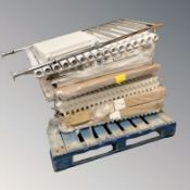 Twelve radiators, all unused from warehouse stock.