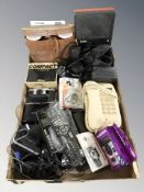 A group of binoculars, Pentax and other cameras, vintage telephones, Philips tape recorder, etc.