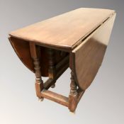 A 19th century mahogany drop leaf kitchen table,